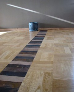 Architectural artwork created on a floor to link two rooms
