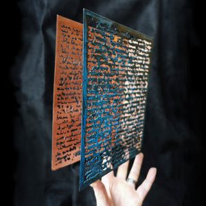 Book made of etched and patinated copper