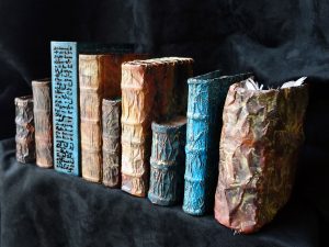 Books made of etched and patinated copper